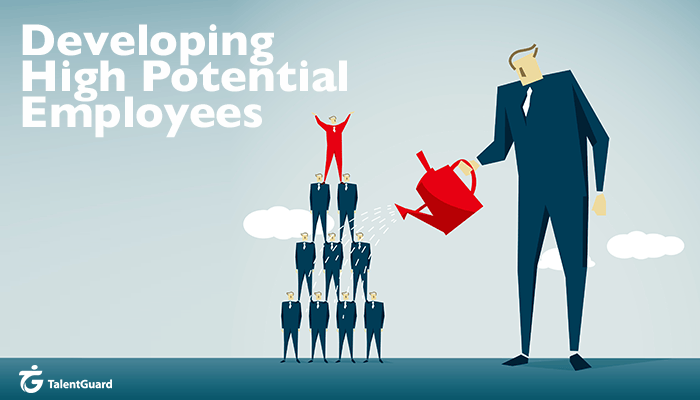Employer watering a group of high potential employees stacked into a pyramid, with the employee on top of the pyramid cheering